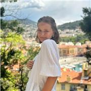 Young teacher, working with teens and adults on improvement of the English language skills.